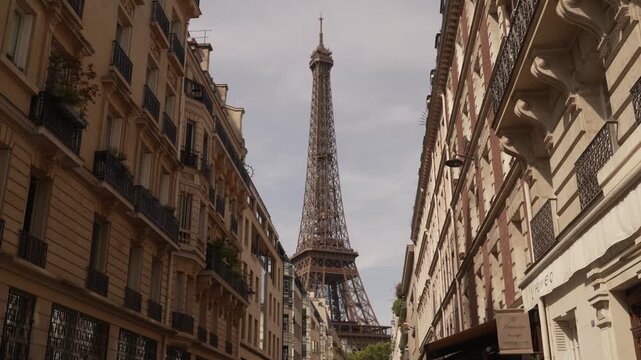 Eiffel Tower closing the end of a narrow Paris street