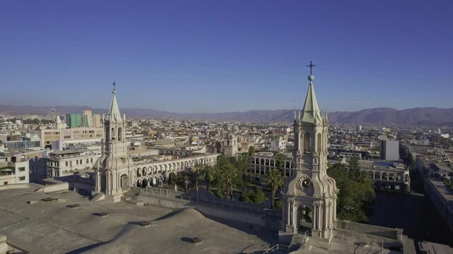 Aerial view of Arequipa Cathedral with its twin towers and stone facade overlooking the historic city center of Arequipa, Arequipa, Peru.