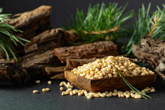 Peeled pine nuts with cedar dried snags and green branches.