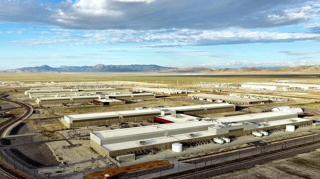Aerial view of the expansive Meta Data Center complex surrounded by desert landscape and distant mountains in Eagle Mountain, Utah, United States.