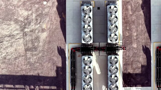 Aerial view of industrial cooling fans at the Eagle Mountain Meta Data Center with adjacent gravel grounds in Eagle Mountain, Utah, United States.