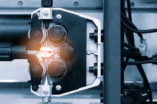 Part of modern welding machine with wire feeder for welding, tech industrial technology background