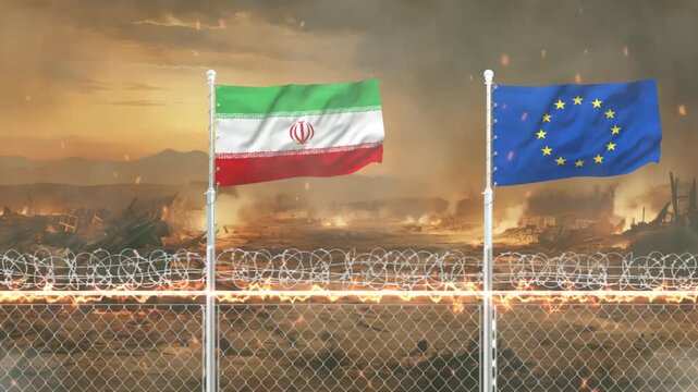 Flags of Iran and European Union waving above barbed wire fence against backdrop of war zone scenery.