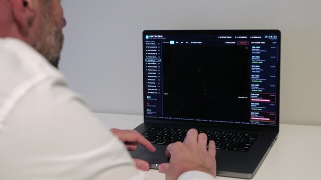 Investigator Detective on laptop using automated license plate reader software to track vehicle locations, illustrating law enforcement surveillance