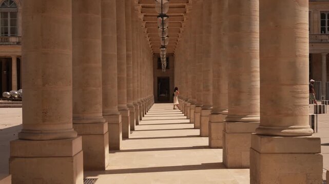 Receding row of columns in a covered walkway in Paris