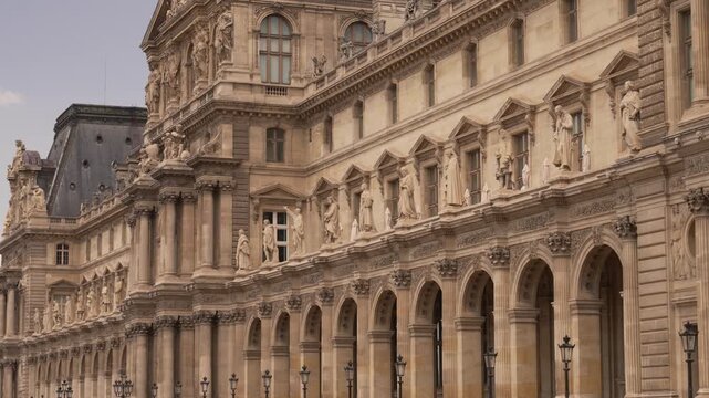 Rows of arches along a long palace facade in central Paris