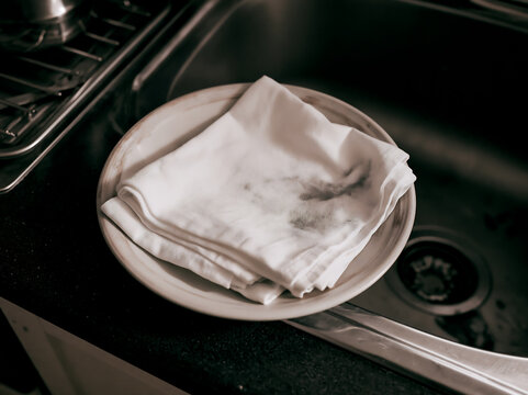Textile with accidental ink splashes on a dish in a kitchen
