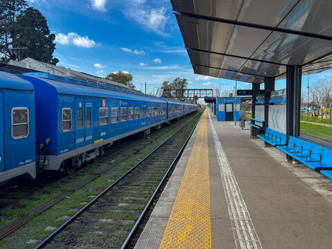 Main platform view and passenger train at Pilar railway station - Argentina