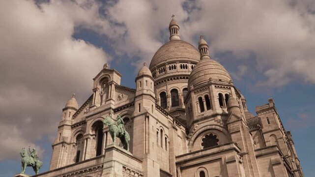 Domes and equestrian statue on the basilica in Montmartre Paris