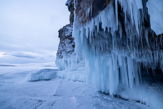 View of the frozen cliffs of Lake Baikal covered in massive icicles and snow during winter in Irkutsk, Irkutsk Oblast, Russia.