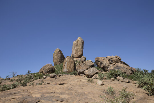 View of large granite rock formations in the arid landscape of the Namunyak Wildlife Conservancy in Lpachie, Samburu County, Kenya.