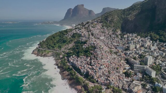 Aerial view of the Vidigal favela perched on the hillside overlooking the Atlantic Ocean and coastline in Rio de Janeiro, State of Rio de Janeiro, Brazil.