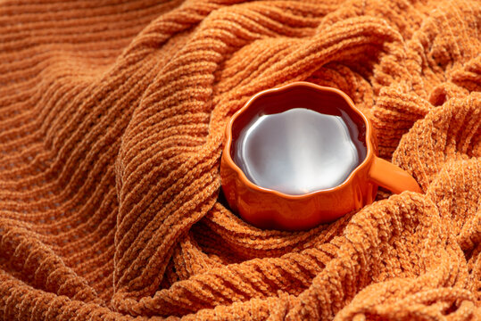 Cozy Autumn Beverage Comfort in Warm Orange Textile Fabric