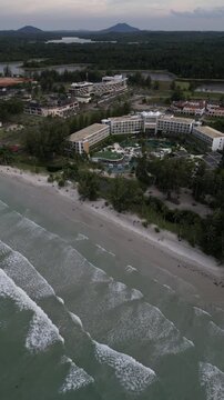 Aerial view of Four Points by Sheraton Bintan, Lagoi Bay, surrounded by lush tropical greenery and white sandy beaches in Bintan, Kepulauan Riau, Indonesia.