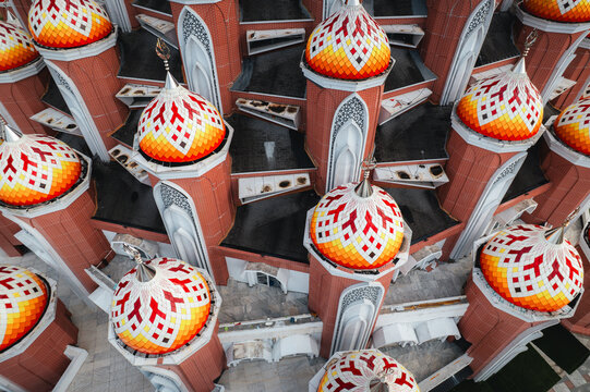 Aerial view of Masjid Kubah 99 Asmaul Husna with its distinctive colorful domes and intricate architectural details in Makassar, Sulawesi Selatan, Indonesia.