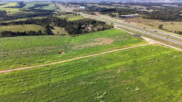 Aerial view of agricultural fields and farmland in a sunny day