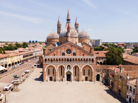 Aerial view of The Basilica of St. Anthony with its distinctive domes and brick facade, situated in the historic city center of Padua, Veneto, Italy.