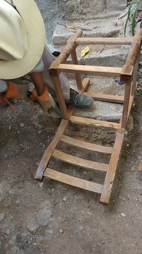 Cut Section of Wooden Chair Frame Falling Off During Sawing