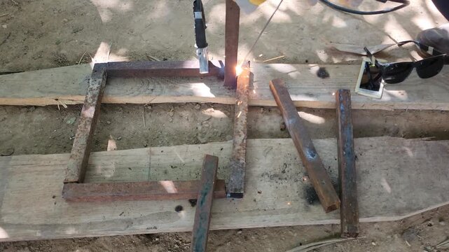 Welding First Leg Joint of Metal Base Frame with Arc Welder