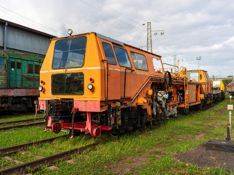 View of an orange railway maintenance vehicle at the Railway Museum Outdoors Exposition, Vilnius, Vilniaus apskritis, Lithuania.