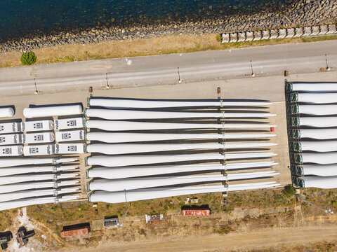 Aerial view of wind turbine blades stored in rows at the Port of Sines, Setubal, Portugal.
