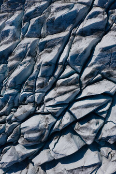 Aerial view of Skaftafellsjokull glacier with deep crevasses and intricate ice textures in Vik, Myrdalshreppur, Iceland.