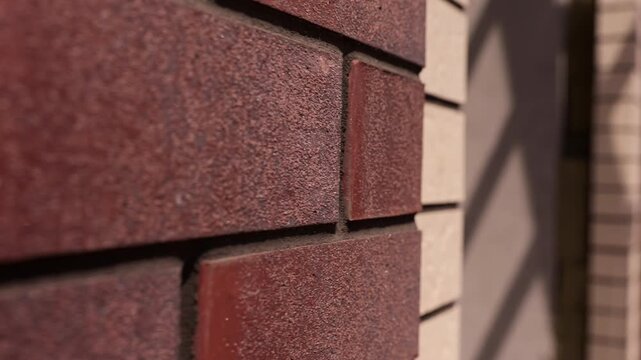 Red brick wall under construction close up