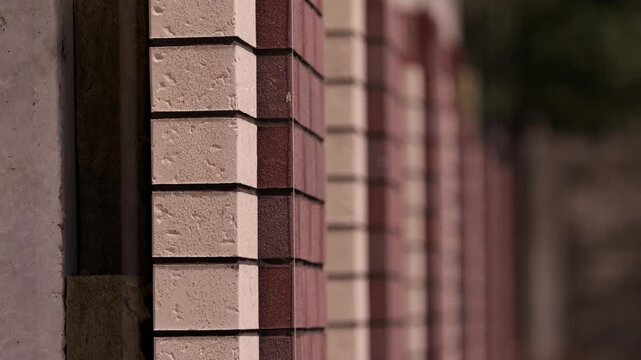Brick facade of residential building under construction close up