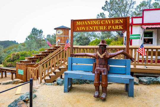 Wooden statue greets visitors at Moaning Cavern Park