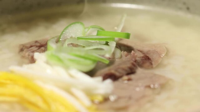 Korea gombang beef bone soup clear beef soup with rice spoon wooden spoon bowl traditional korean food Korea gomtang 한국 나주곰탕 곰탕 소고기 국밥 숟가락 밥 고기 대파 육수 국물 한식 식재료 전통