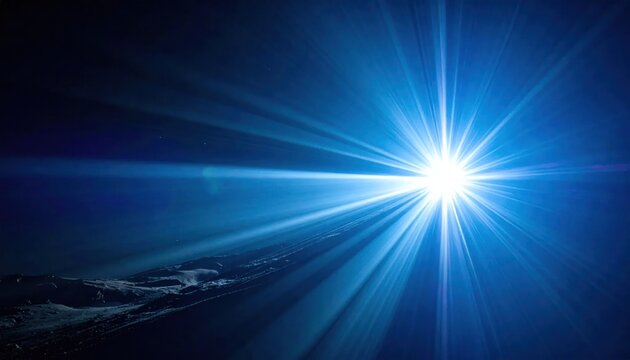 Bright blue starburst light effect on dark background.
