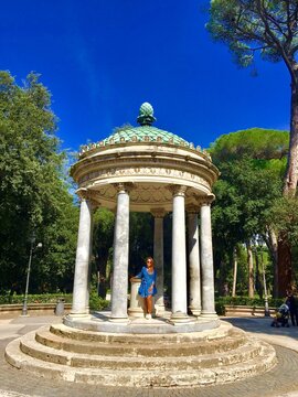 Ancient Roman temple pavilion with pinecone dome at Villa Borghese Gardens, Rome.