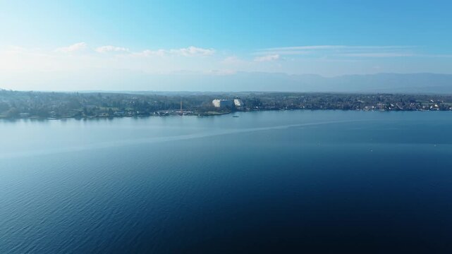 Aerial view of the modern Lombard Odier headquarters situated on the serene shoreline of Lake Geneva in Bellevue, Geneve, Switzerland.