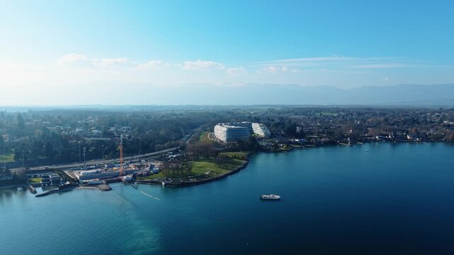 Aerial view of the modern Lombard Odier headquarters building situated on the scenic waterfront of Lake Geneva in Bellevue, Geneve, Switzerland.