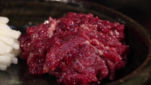Korea raw beef yukhoe beef tartare seasoned raw beef with lotus root pine nuts sesame oil traditional korean food dish meal cuisine Korea 한국 소고기 육회 생고기 한우 연근 잣 참기름 양념육회 우둔살 한식 식재료 전통음식 대표요리