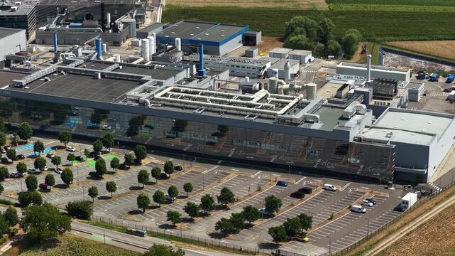 Bernin, France - August 1, 2026: Wide aerial view of Soitec semiconductor manufacturing complex producing advanced silicon wafers and materials for the global microelectronics industry