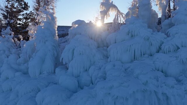 Aerial view of ice-covered trees and frozen landscape at Lake Baikal in Khuzhir, Irkutsk Oblast, Russia.