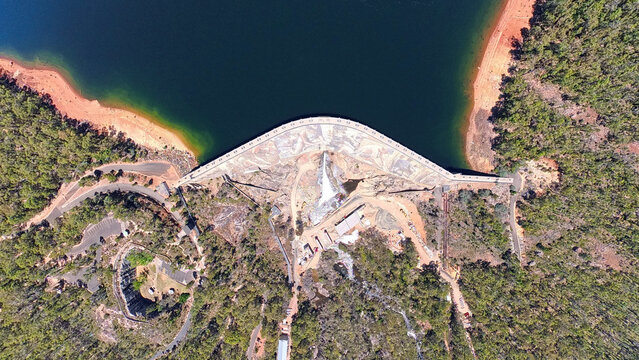 Worsley, Western Australia, Australia - 05 January 2026: Aerial view of Wellington Dam showing the concrete wall, reservoir water, and surrounding dense forest landscape.