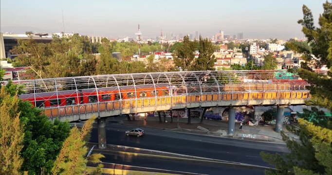 Aerial view of a pedestrian bridge with metal frame structure spanning over a road near the Tapo bus terminal in Ciudad de Mexico, Ciudad de Mexico, Mexico.