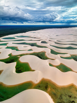 Aerial view of the white sand dunes and turquoise lagoons of Lagoa Bonita in the Lencois Maranhenses National Park in Barreirinhas, State of Maranhao, Brazil.
