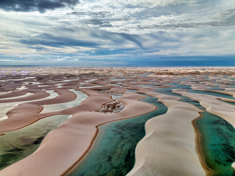 Aerial view of the turquoise lagoons and white sand dunes of Lagoa Bonita in Lencois Maranhenses National Park, Barreirinhas, State of Maranhao, Brazil.