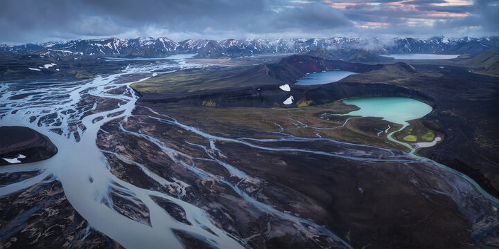 Aerial view of the braided river system and turquoise crater lakes within the volcanic landscape of Fjallabak Nature Reserve in Rangarthing ytra, Iceland.