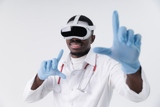Portrait African male doctor using vr headset for medical simulation and gesture control. Futuristic interactive med technology AI assistant for data analysis concept.