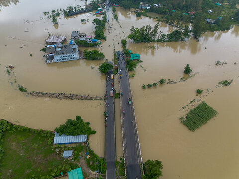 Satkania, Chittagong Division, Bangladesh - 11 July 2026: Aerial view of the flooded Chittagong - Bandarban Highway with vehicles on the submerged road surrounded by floodwaters.