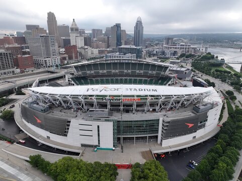 Cincinnati, United States - 12 July 2026: Aerial view of Paycor Stadium with the city skyline in the background under a cloudy sky.