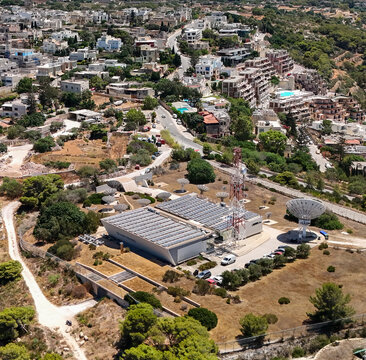 Aerial view of Melita telecom hub in Malta with towers and solar panels