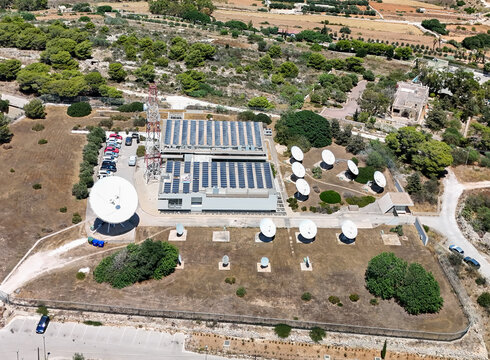 Aerial view of Malta satellite ground station with antennas and solar panels
