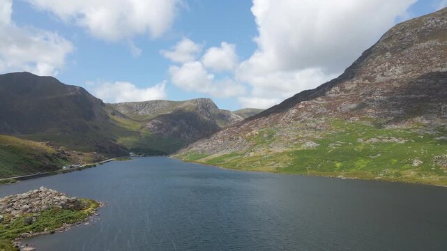 Drone moving over the lake in the valley at Llyn Ogwen, Wales