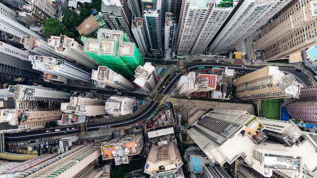 Aerial view of dense skyscrapers and urban streets in Hong Kong, Hong Kong.