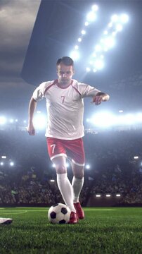 Soccer Player Dribbling the Ball Toward Camera